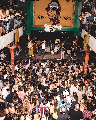 From Norwich to New Orleans - concert with band on stage and crowd in front of stage