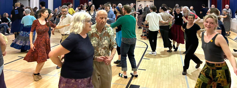 Dancers take to the floor at Tracy Hall during a contra dance in February.