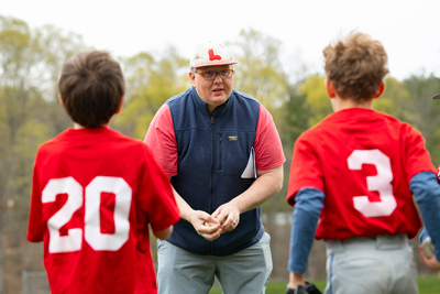 NBA president Michael Costa and two young Norwich baseball players